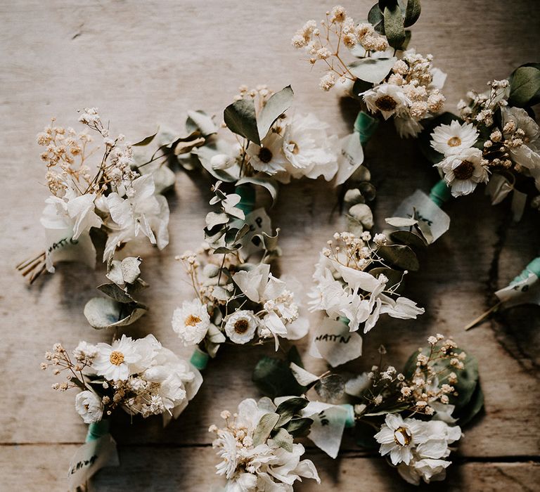 white-wedding-buttonholes-for-groom