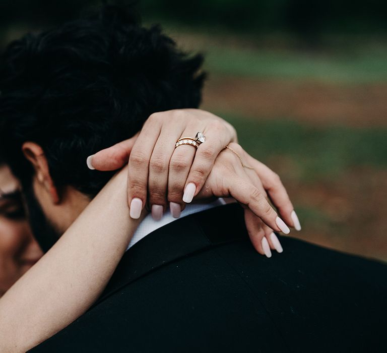 bride-embracing-groom-at-wedding