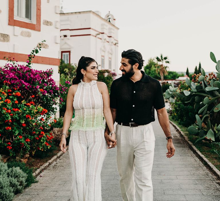 bride-in-knitted-jumpsuit-with-groom-in-black-shirt