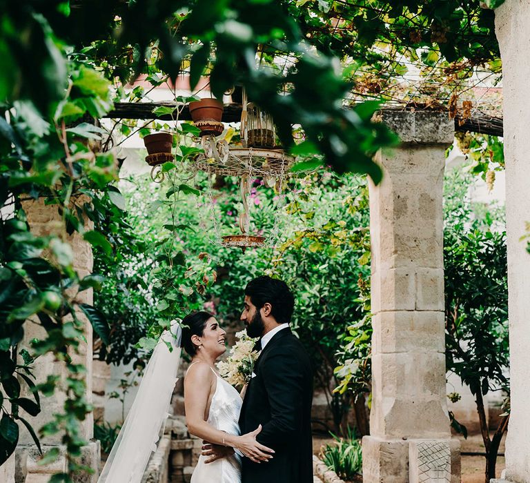 bride-in-satin-slip-wedding-dress-with-groom-in-black-tux