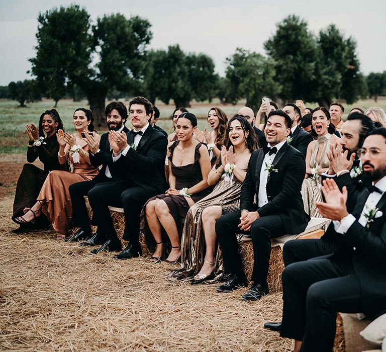 wedding-guests-applaud-at-wedding-ceremony