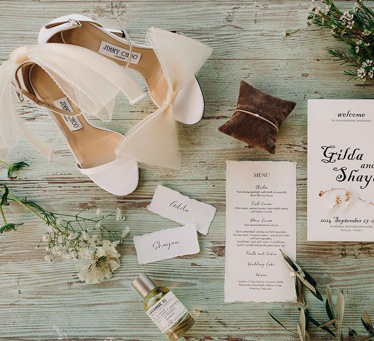 wedding-invitations-and-white-bow-wedding-shoes