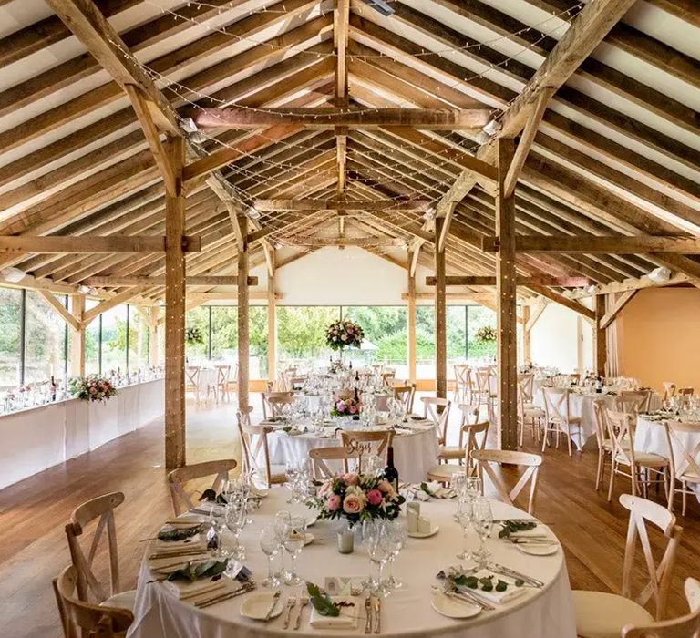 indoor ceremony area at affordable wedding venue, bredenbury court barns