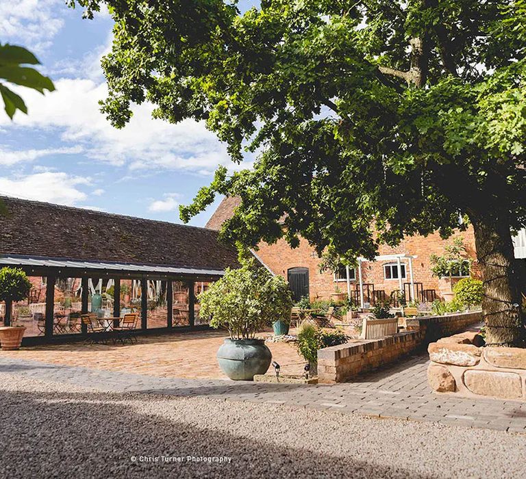 exterior of affordable wedding venue, curradine barns