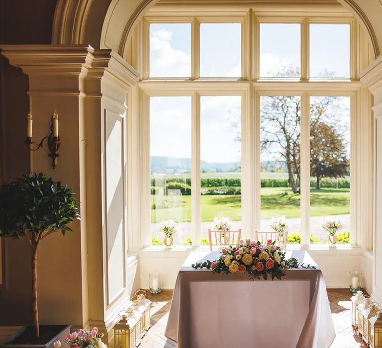 view of lawns from inside glewstone court country house, affordable wedding venue