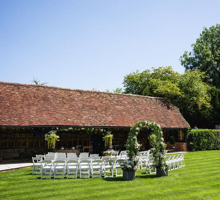 outdoor ceremony area at lains barn affordable wedding venue in oxfordshire