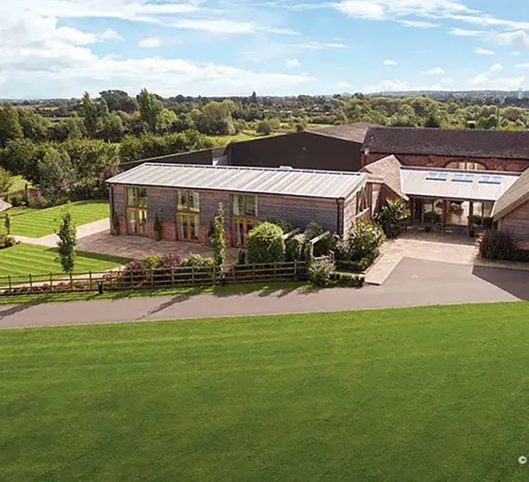 view of affordable wedding venue and gardens, mythe barn