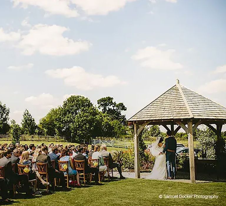 outdoor wedding ceremony at affordable wedding venue, mythe barn