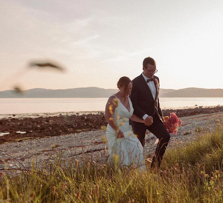 couple on their wedding on the The Dougarie Boathouse venue private beach