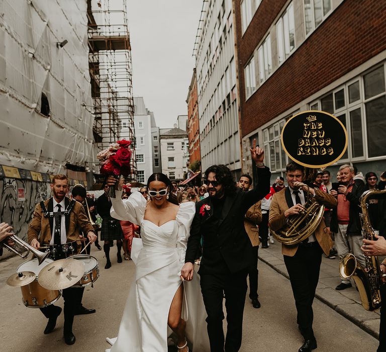 bride-and-groom-with-brass-band-on-streets-of-dublin