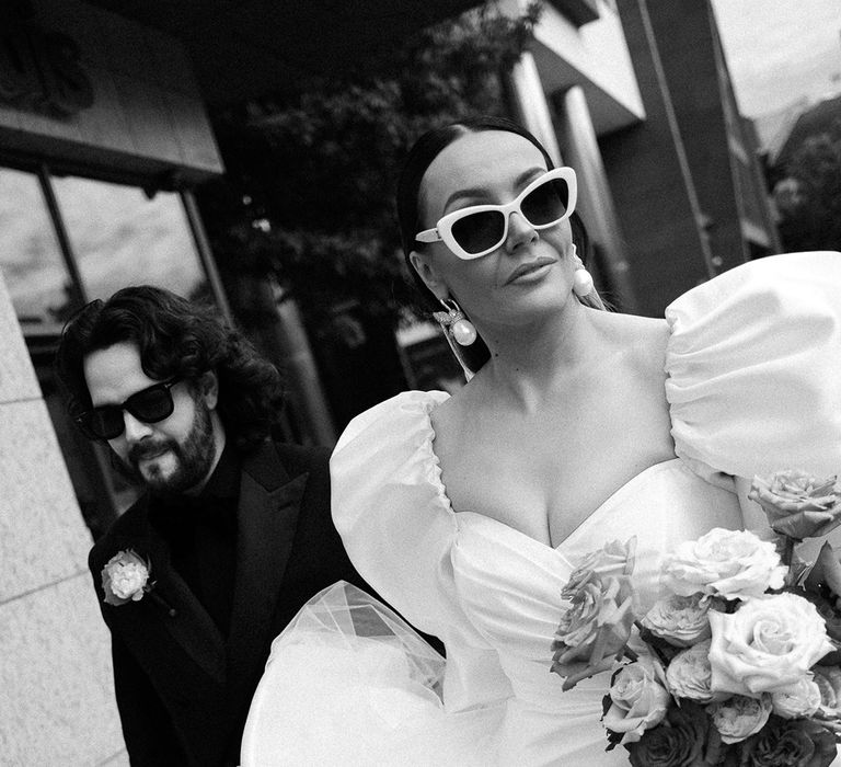 bride-in-puff-sleeve-wedding-dress-with-sunglasses
