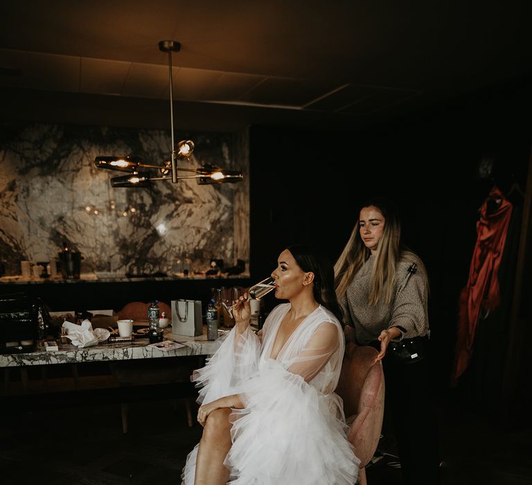 bride-in-tulle-luxe-robe-getting-ready-for-wedding