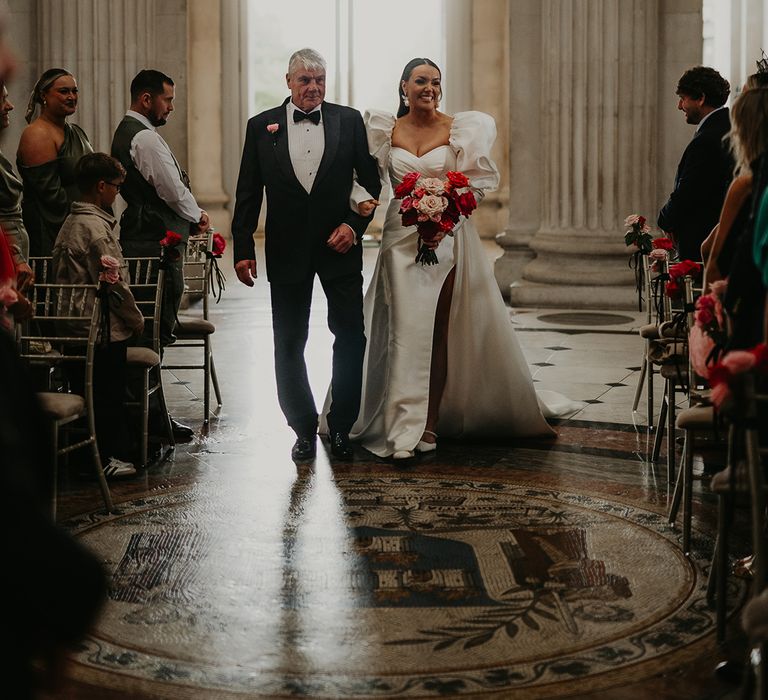 father-of-the-bride-in-black-tuxedo-walks-bride-down-the-aisle