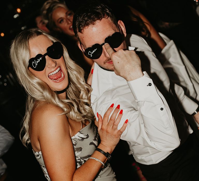 wedding-guests-wearing-personalised-wedding-sunglasses