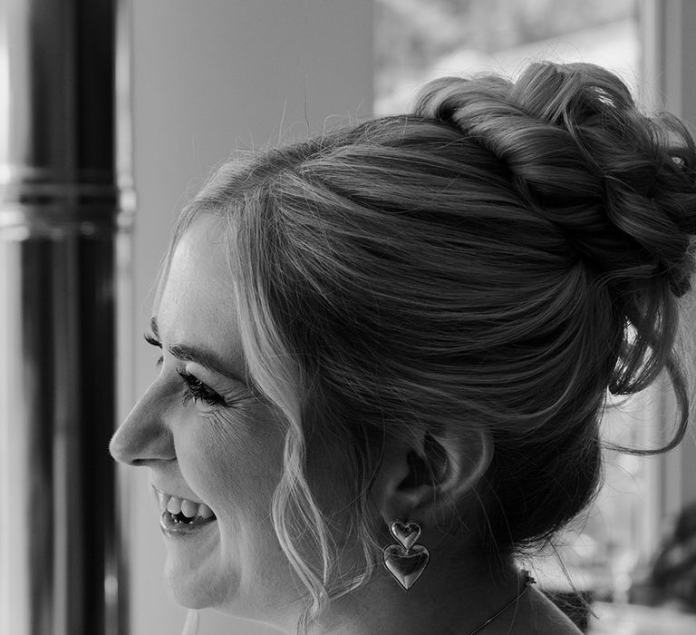 bridal-updo-hairstyle-with-heart-earrings