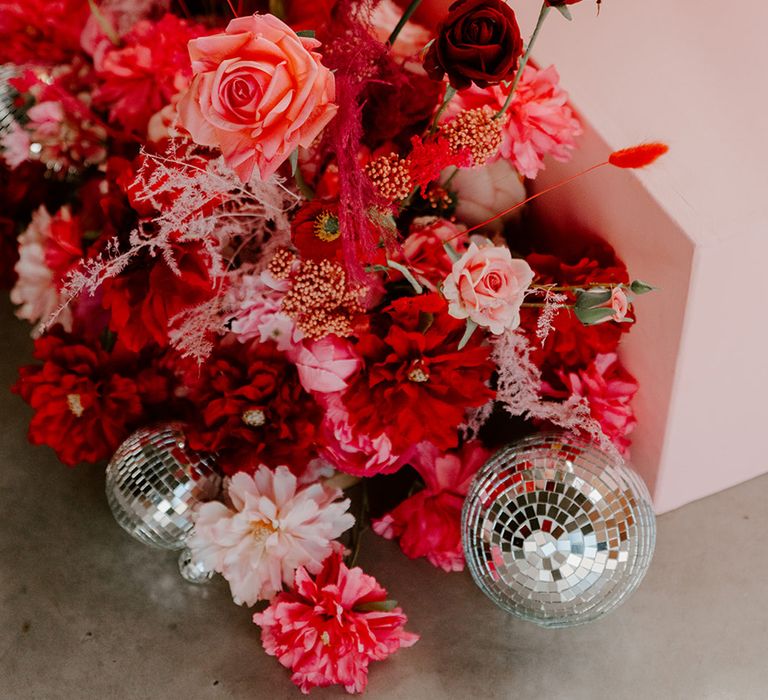 bright-pink-wedding-flower-arrangements-with-disco-ball