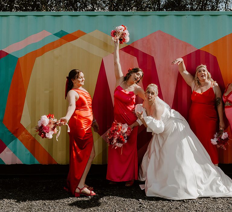 mismatched-pink-and-orange-bridesmaid-dresses