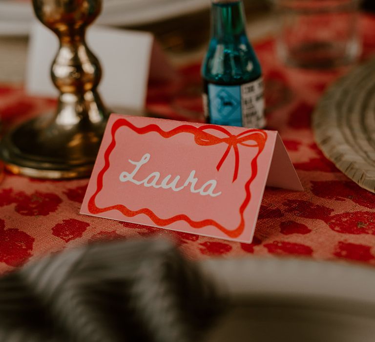 pink-and-red-bow-wedding-place-name-cards