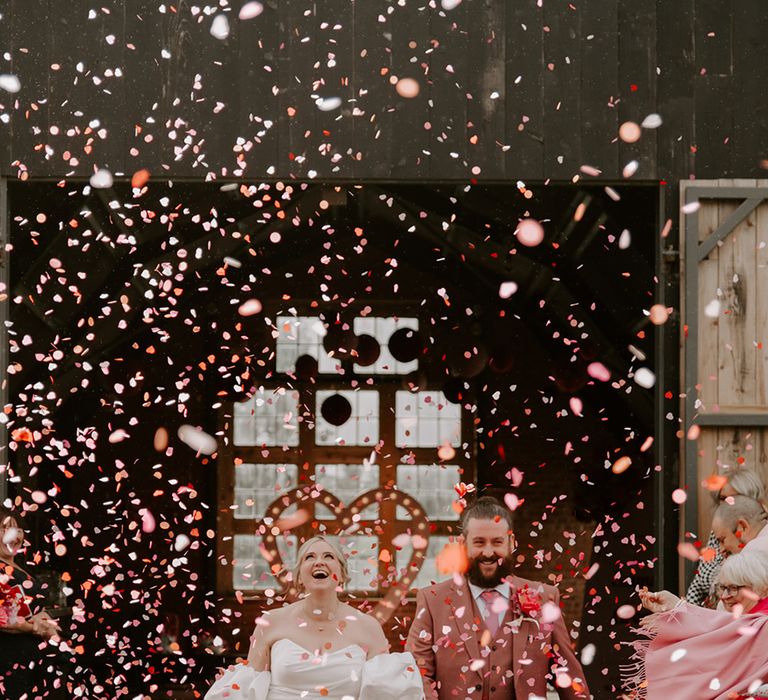 pink-confetti-moment-at-giraffe-shed-wedding