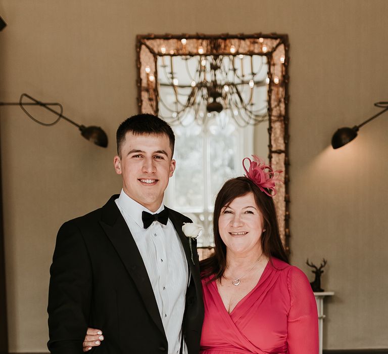 groom-with-mother-of-the-groom-in-pink-dress