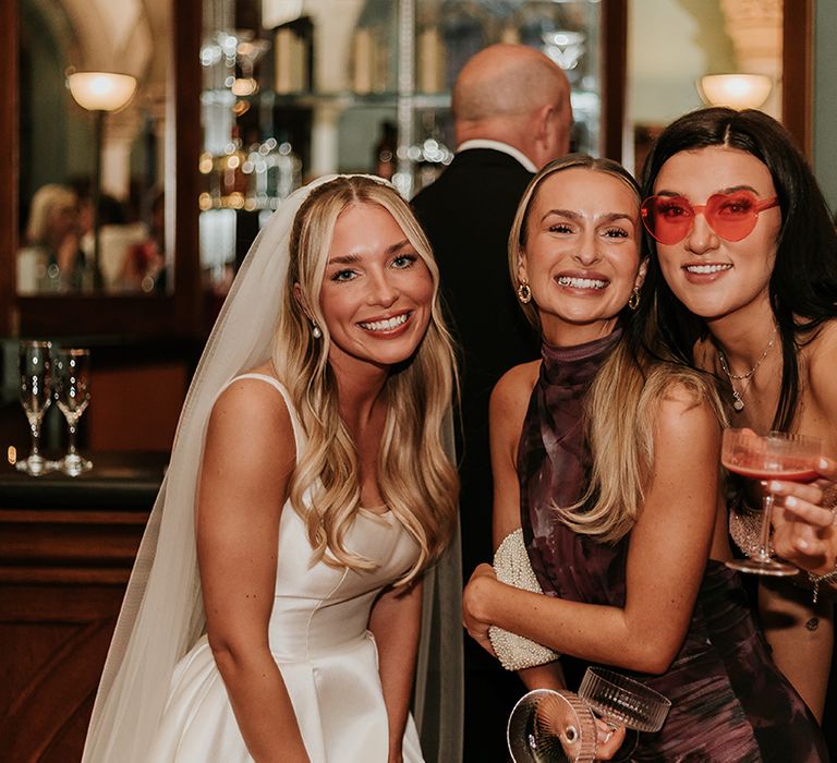 wedding-guests-posing-with-bride