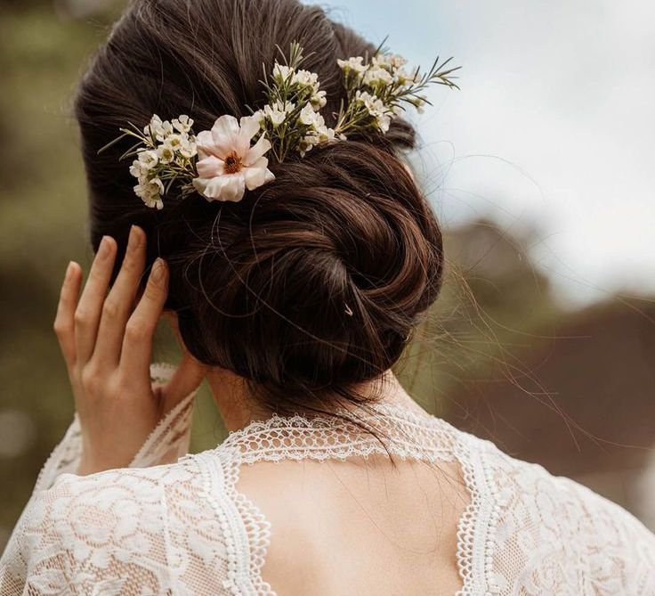 bride-with-black-wedding-hair-in-updo-with-hair-accessory