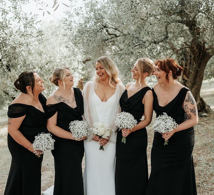 Bridal Party in Black Bridesmaid Dresses with White Gypsophila Bouquets