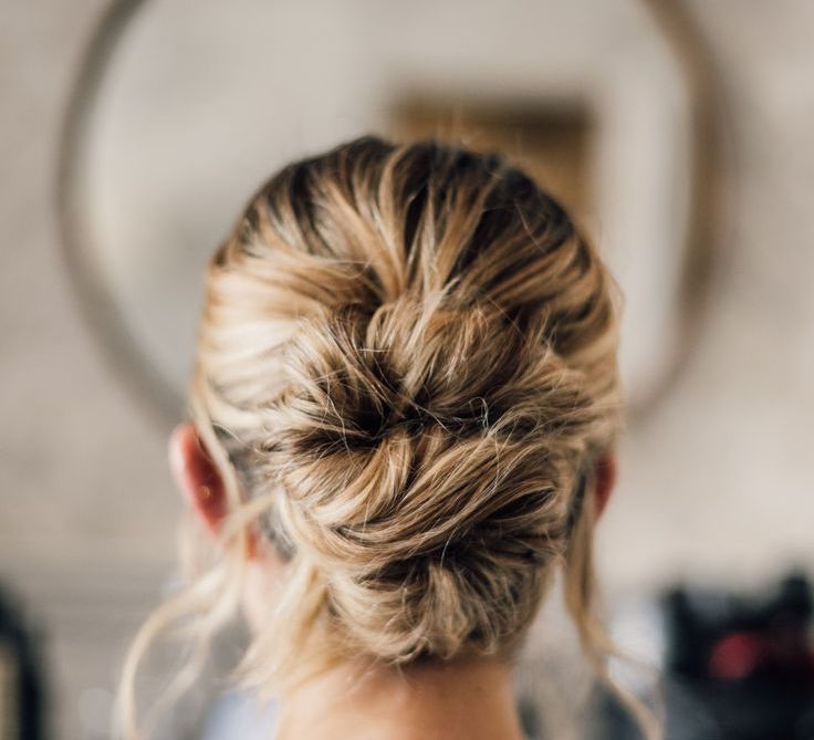 Bride Wearing Blonde Hair in Messy Natural Updo Hairstyle