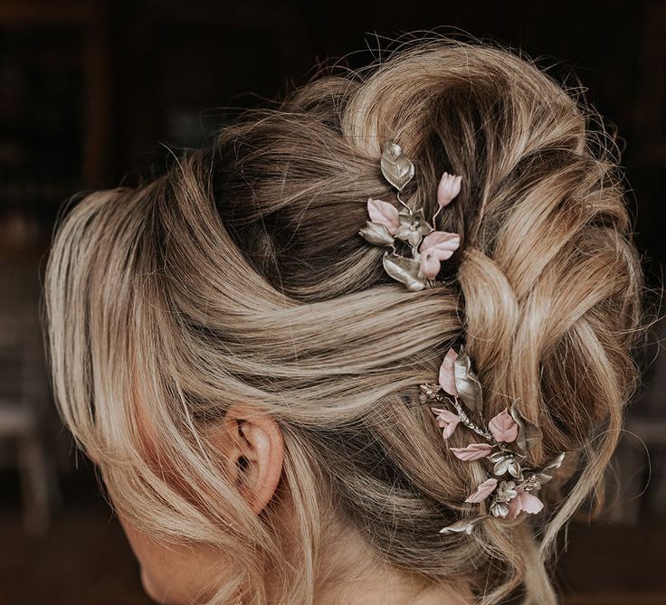 Intricate Wedding Hairstyle With Enamel Pink Floral Hair Accessory