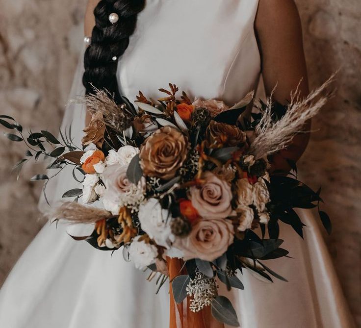 bride-with-hair-in-one-large-braid-style