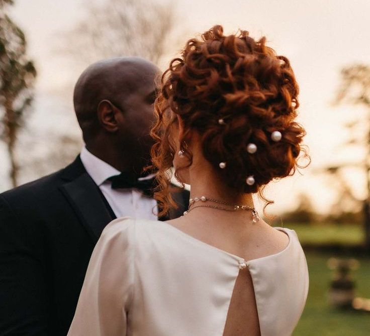 bride-with-curly-hair-in-updo-with-pearl-pins