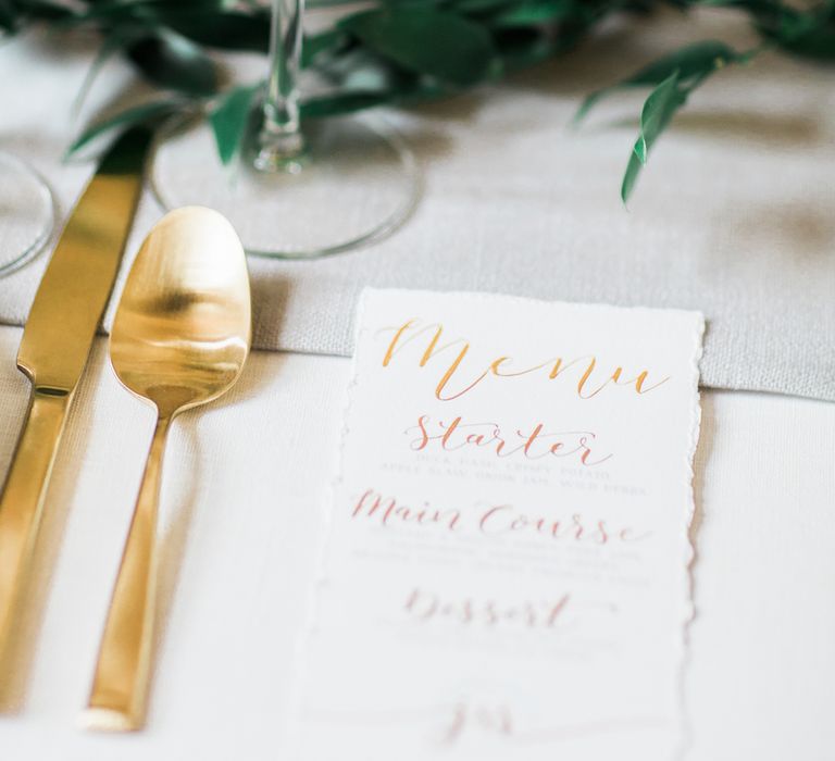 Elegant Place Setting With Gold Cutlery & Foliage Table Runner