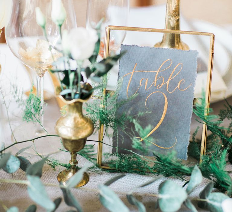 Elegant Place Setting With Gold Cutlery & Foliage Table Runner