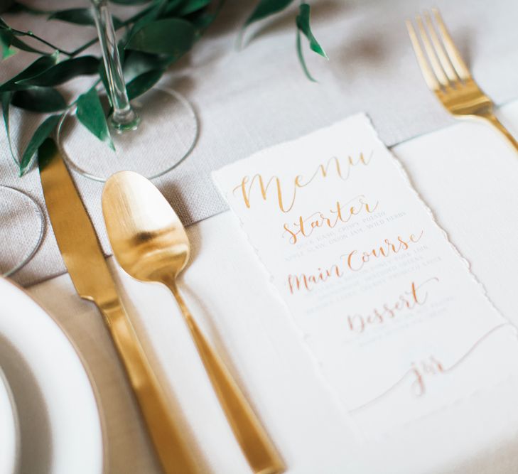 Elegant Place Setting With Gold Cutlery & Foliage Table Runner