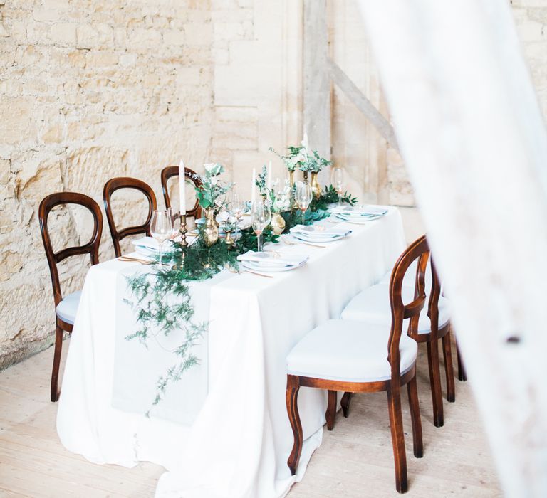 Elegant Place Setting With Gold Cutlery & Foliage Table Runner