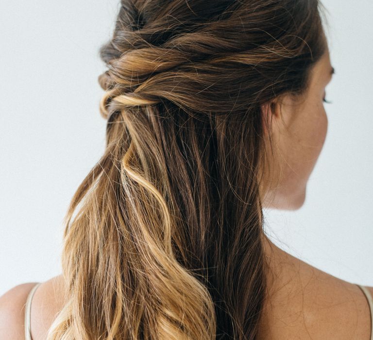 Twisted Pony Tail With Tousled Waves