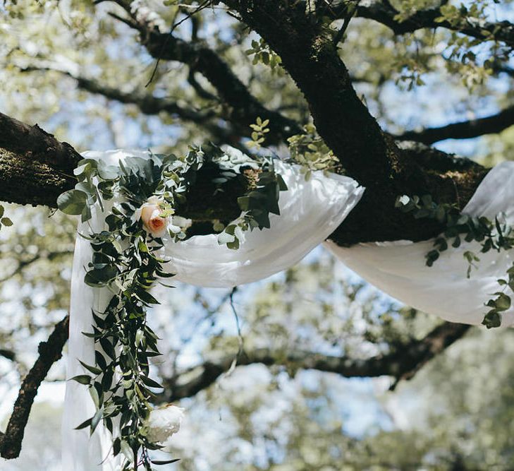 Flowers & fabric dropped in the forest to create an altar