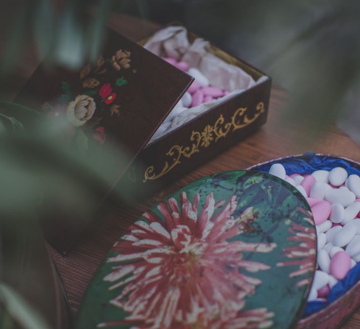 Outdoor Wedding Ceremony in Tuscany With Bright Florals And Rustic Wooden Seating