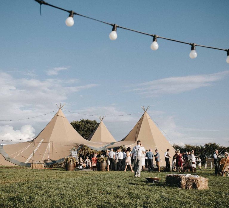 Abbi From Save The Date Magazine Gets Married Wearing Margaux Taridts & Grace Loves Lace Outdoor Festival Wedding With Tipis, Bell Tent Camping & Festoon Lights