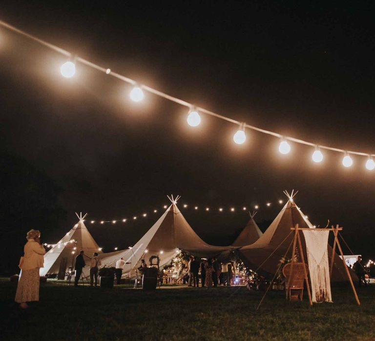 Abbi From Save The Date Magazine Gets Married Wearing Margaux Taridts & Grace Loves Lace Outdoor Festival Wedding With Tipis, Bell Tent Camping & Festoon Lights