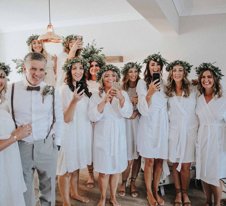 Bridesmaids In White Dresses With Foliage Crowns // Abbi From Save The Date Magazine Gets Married Wearing Margaux Taridts & Grace Loves Lace Outdoor Festival Wedding With Tipis, Bell Tent Camping & Festoon Lights