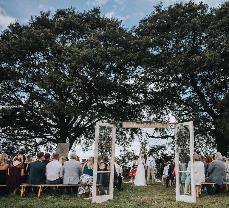 Abbi From Save The Date Magazine Gets Married Wearing Margaux Taridts & Grace Loves Lace Outdoor Festival Wedding With Tipis, Bell Tent Camping & Festoon Lights