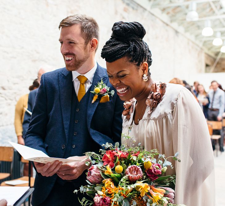 Wedding Ceremony | Bride in Bespoke Ailsa Monroe Jumpsuit & Cape | Groom in Next Navy Wool Suit | Relaxed Industrial Wedding at Ocean Studios, Plymouth | Freckle Photography