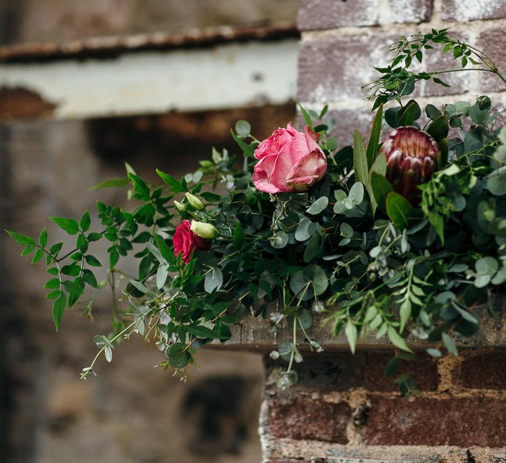 Fireplace Wedding Flower Display | | Relaxed Industrial Wedding at Ocean Studios, Plymouth | Freckle Photography