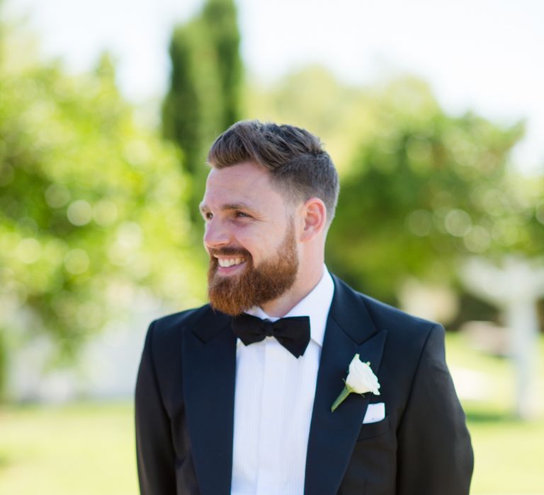 Groom in Black Tie Wedding Suit | Outdoor Ibiza Destination Wedding | Gypsy Westwood Photography | Infin8 Film