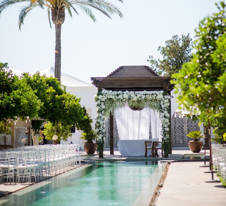 White Flower Wedding Arbour | Outdoor Ibiza Destination Wedding | Gypsy Westwood Photography | Infin8 Film