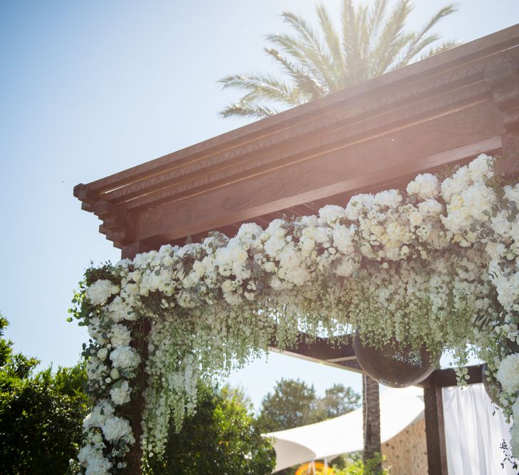 White Flower Wedding Arbour | Outdoor Ibiza Destination Wedding | Gypsy Westwood Photography | Infin8 Film