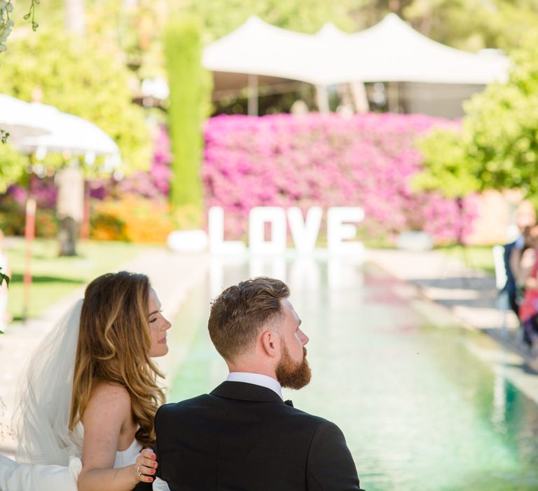 Bride in Suzanne Neville Wedding Dress | Groom in Reiss Suit | Outdoor Ibiza Destination Wedding | Gypsy Westwood Photography | Infin8 Film