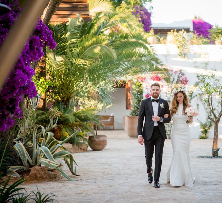 Bride in Suzanne Neville Wedding Dress & Flower Crown | Groom in Reiss Suit | Outdoor Ibiza Destination Wedding | Gypsy Westwood Photography | Infin8 Film