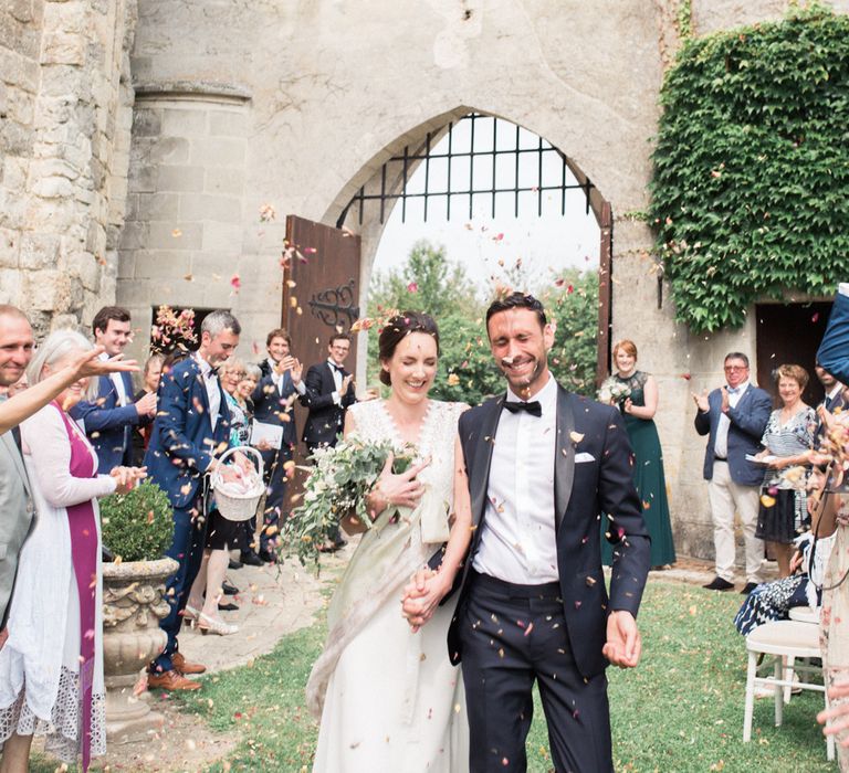 Confetti Moment | Bride in Pronovias Gown | Groom in Black Tie | Fairytale Castle Wedding at Chateau de Lisse in France | Lilli Kad Photography